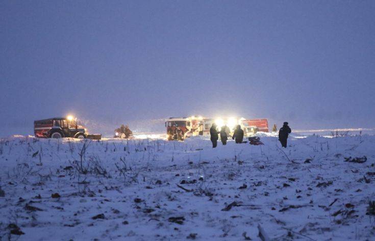 In this photo provided by the Russian Emergency Situations Ministry, Russian Ministry for Emergency Situations employees work at the scene of a AN-148 plane crash in Stepanovskoye village, about 40 kilometers (25 miles) from the Domodedovo airport, Russia, Sunday, Feb. 11, 2018. Russia's Emergencies Ministry says a passenger plane has crashed near Moscow and fragments of it have been found. Russian officials say all passengers aboard the airliner that has crashed outside Moscow are believed to have been residents of the region that was the plane's destination. No survivors have been reported. (Russian Ministry for Emergency Situations photo via AP)