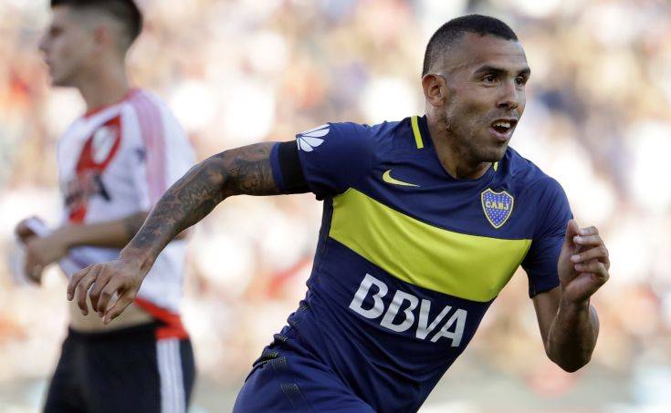 FILE - In this Sunday, Dec. 11, 2016 file photo, Boca Juniors' forward Carlos Tevez celebrates scoring against River Plate during a local tournament soccer match in Buenos Aires, Argentina. Argentine striker Carlos Tevez has signed to play for Shanghai Shenhua, becoming the latest in a procession of star players to join the Chinese Super League. Shanghai Shenhua said Thursday Dec. 29, 2016, that it paid an $11 million transfer fee to Argentine club Boca Juniors. (AP Photo/Natacha Pisarenko, File) FILE - In this Sunday, Dec. 11, 2016 file photo, Boca Juniors' forward Carlos Tevez celebrates scoring against River Plate during a local tournament soccer match in Buenos Aires, Argentina. Argentine striker Carlos Tevez has signed to play for Shanghai Shenhua, becoming the latest in a procession of star players to join the Chinese Super League. Shanghai Shenhua said Thursday Dec. 29, 2016, that it paid an $11 million transfer fee to Argentine club Boca Juniors. (AP Photo/Natacha Pisarenko, File)