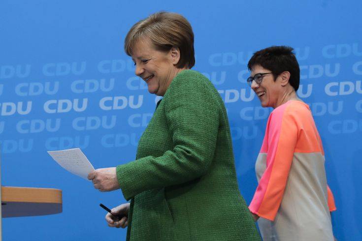 German Chancellor Angela Merkel, left, and the governor of German Saarland state and designated CDU Secretary General, Annegret Kramp-Karrenbauer, right,arrive at a news conference after a party's leaders meeting in Berlin, Germany, Monday, Feb. 19, 2018. (AP Photo/Markus Schreiber) German Chancellor Angela Merkel, left, and the governor of German Saarland state and designated CDU Secretary General, Annegret Kramp-Karrenbauer, right,arrive at a news conference after a party's leaders meeting in Berlin, Germany, Monday, Feb. 19, 2018. (AP Photo/Markus Schreiber)