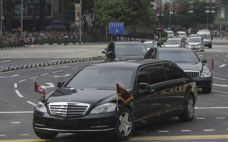 A limousine, front, with a North Korean flag believed to be carrying leader Kim Jong Un travels past Singapore's Orchard Road on its way to the St Regis Hotel as he arrives in Singapore on Sunday, June 10, 2018. Kim arrived Sunday in Singapore ahead of one of the most unusual summits in recent world history, a sit-down Tuesday with President Donald Trump. (AP Photo/Joseph Nair)