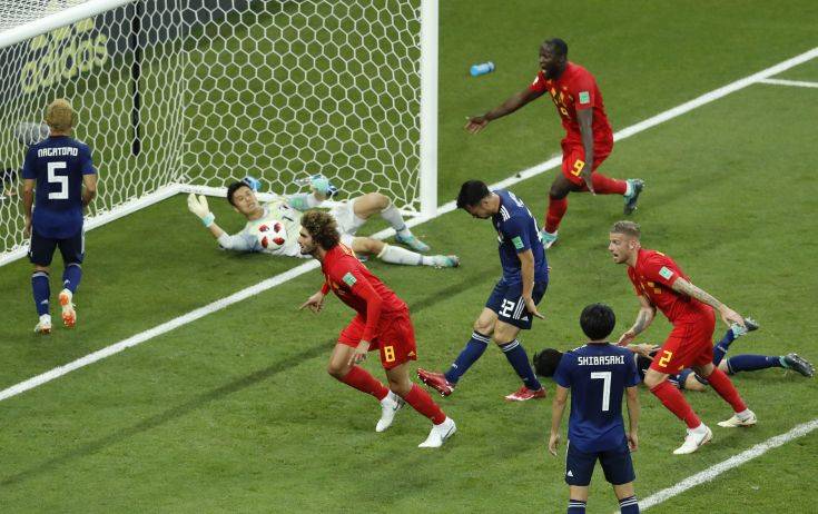 Belgium's Marouane Fellaini, center, celebrates after scoring his second side goal during the round of 16 match between Belgium and Japan at the 2018 soccer World Cup in the Rostov Arena, in Rostov-on-Don, Russia, Monday, July 2, 2018. (AP Photo/Hassan Ammar)