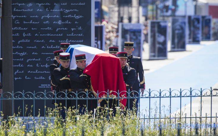 The flag-draped coffin of late Auschwitz holocaust survivor, French health minister Simone Veil, is carried during a national tribute before being laid to rest in the crypt of the Pantheon mausoleum in Paris, Monday, July 1, 2018. Veil who became one of France's most revered politicians is getting the rare honor of being buried at the Pantheon, where French heroes are interred, one year after her death. (AP Photo/Kamil Zihnioglu)