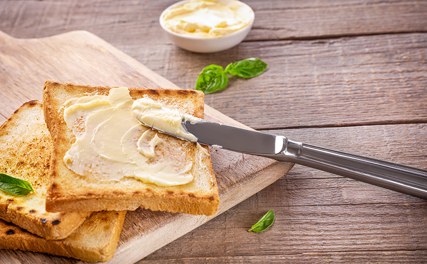 Βούτυρο σε ψωμί του τοστ Βούτυρο σε ψωμί του τοστ