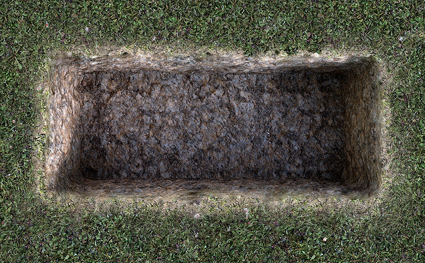 Child buried face down with a padlock under his leg to keep him from