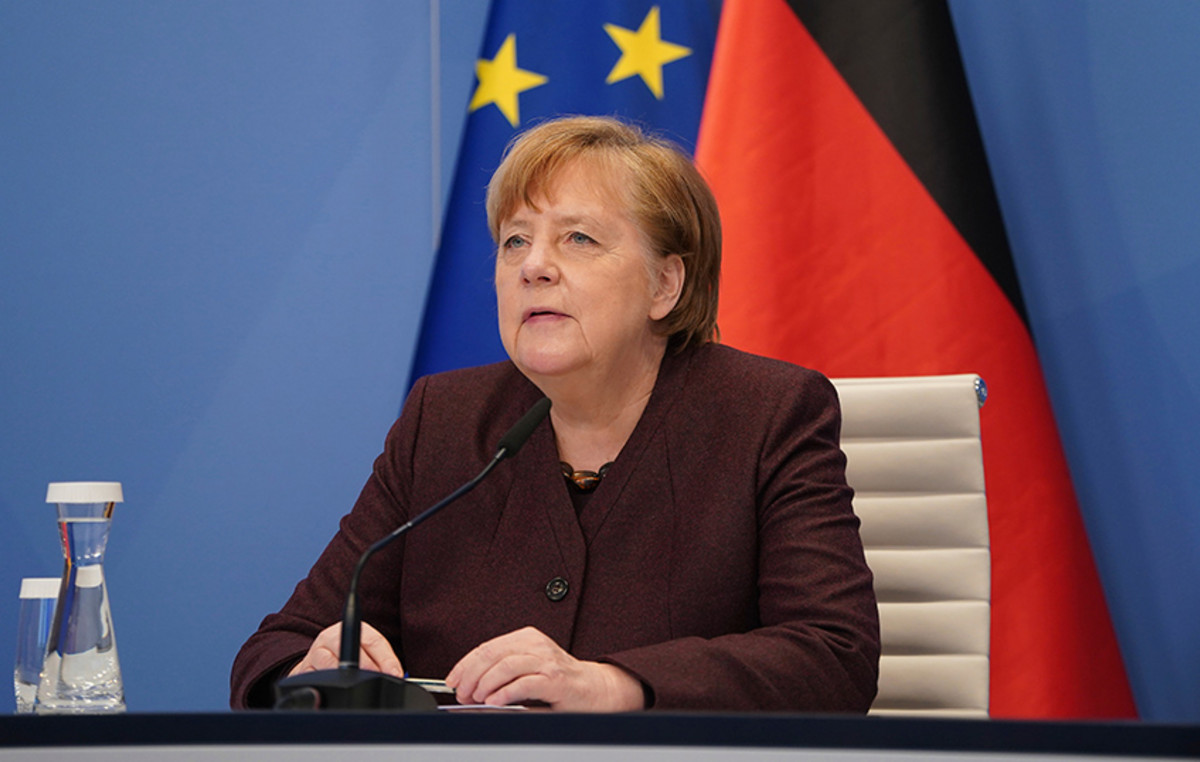 Ten years after the decision to open German border to refugees, Merkel is seeing progress in integrating immigrants