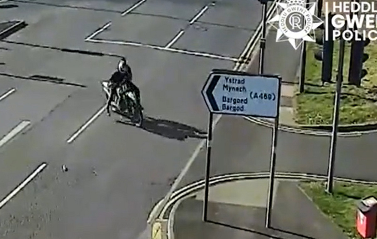 Frame-Frame The Motion of a Motorcyclist drags a police officer on the roadway during chasing