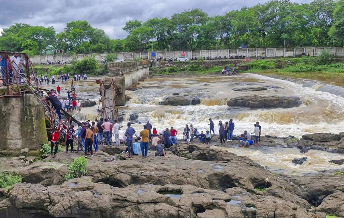 Tragedy in India: At least two dead and dozens missing from a bridge collapse over river in tourist destination