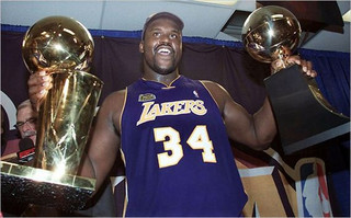 08-Shaq-Holding-Things