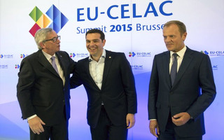 European Commission President Jean-Claude Juncker and European Council President Donald Tusk welcome Greece's Prime Minister Alexis Tsipras at the start of an EU-CELAC Latin America summit in Brussels