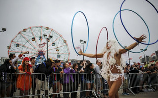 People watch the Mermaid Parade on the streets of Coney Island in Brooklyn, New York June 20, 2015. The annual parade, founded in 1983, seeks to bring mythology to life for residents, create confidence in the district and to allow artistic self-expression in public, according to the parade's website. REUTERS/Eduardo Munoz