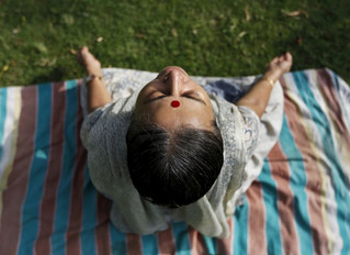 A woman practices yoga at a public park ahead of World Yoga Day, in Ahmedabad, India, June 14, 2015. World Yoga Day is celebrated on June 21. REUTERS/Amit Dave
