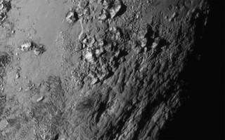 A new close-up image of a region near Plutos equator reveals a range of youthful mountains rising as high as 11,000 feet (3,500 meters) above the surface of the icy body, in a picture released by NASA in Laurel, Maryland July 15, 2015.  A U.S. spacecraft sailed past the tiny planet Pluto in the distant reaches of the solar system on Tuesday, capping a journey of 3 billion miles (4.88 billion km) that began nine and a half years ago. NASA's New Horizons spacecraft passed by the ice-and-rock planetoid and its entourage of five moons at 7:49 a.m. EDT (1149 GMT). The event culminated an initiative to survey the solar system that the space agency embarked upon more than 50 years ago.  REUTERS/NASA New Horizons/Handout via Reuters   TPX IMAGES OF THE DAY. THIS IMAGE HAS BEEN SUPPLIED BY A THIRD PARTY. IT IS DISTRIBUTED, EXACTLY AS RECEIVED BY REUTERS, AS A SERVICE TO CLIENTS. FOR EDITORIAL USE ONLY. NOT FOR SALE FOR MARKETING OR ADVERTISING CAMPAIGNS