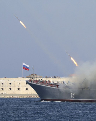 A Russian warship fires during celebrations for Navy Day in Sevastopol