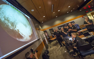 Members of the New Horizons science team react to seeing the spacecraft's last and sharpest image of Pluto before closest approach later in the day at the Johns Hopkins University Applied Physics Laboratory (APL) in Laurel, Maryland July 14, 2015.More than nine years after its launch, a U.S. spacecraft sailed past Pluto on Tuesday, capping a 3 billion mile (4.88 billion km) journey to the solar system's farthest reaches, NASA said. The craft flew by the distant "dwarf" planet at 7:49 a.m. after reaching a region beyond Neptune called the Kuiper Belt that was discovered in 1992. The achievement is the culmination of a 50-year effort to explore the solar system. REUTERS/Bill Ingalls/NASA/Handout ATTENTION EDITORS - FOR EDITORIAL USE ONLY. NOT FOR SALE FOR MARKETING OR ADVERTISING CAMPAIGNS. THIS IMAGE HAS BEEN SUPPLIED BY A THIRD PARTY. IT IS DISTRIBUTED, EXACTLY AS RECEIVED BY REUTERS, AS A SERVICE TO CLIENTS. MANDATORY CREDIT Members of the New Horizons science team react to seeing the spacecraft's last and sharpest image of Pluto before closest approach later in the day at the Johns Hopkins University Applied Physics Laboratory (APL) in Laurel, Maryland July 14, 2015.More than nine years after its launch, a U.S. spacecraft sailed past Pluto on Tuesday, capping a 3 billion mile (4.88 billion km) journey to the solar system's farthest reaches, NASA said. The craft flew by the distant "dwarf" planet at 7:49 a.m. after reaching a region beyond Neptune called the Kuiper Belt that was discovered in 1992. The achievement is the culmination of a 50-year effort to explore the solar system. REUTERS/Bill Ingalls/NASA/Handout ATTENTION EDITORS - FOR EDITORIAL USE ONLY. NOT FOR SALE FOR MARKETING OR ADVERTISING CAMPAIGNS. THIS IMAGE HAS BEEN SUPPLIED BY A THIRD PARTY. IT IS DISTRIBUTED, EXACTLY AS RECEIVED BY REUTERS, AS A SERVICE TO CLIENTS. MANDATORY CREDIT