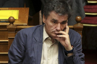 Greek Finance Minister Euclid Tsakalotos reacts during a parliamentary session in Athens, Greece July 15, 2015. A lot of the measures in a deal struck with Greece's lenders will have a recessionary effect but removing the prospect of a "Grexit" will help offset their impact and bring in investments, Tsakalotos said on Wednesday. REUTERS/Yiannis Kourtoglou