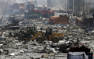 Excavators work near the site of the explosions at the Binhai new district, Tianjin, August 13, 2015. At least 17 people were killed and 400 injured when two huge explosions tore through an industrial area where toxic chemicals and gas were stored in the northeast Chinese port city of Tianjin, state media said on Thursday. REUTERS/Jason Lee