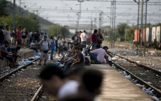 Migrants wait for a train at Gevgelija train station in Macedonia, close to the border with Greece, August 14, 2015. In the past month, an estimated 30,000 refugees have passed through Macedonia, another step in their uncertain search for a better life in western Europe.  REUTERS/Stoyan Nenov