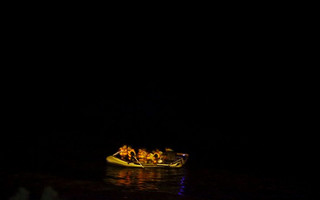 Migrants aboard a dinghy sail off to the Greek island of Kos from the southern Turkish coastal town of Bodrum