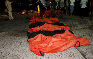 ATTENTION EDITORS - VISUAL COVERAGE OF SCENES OF DEATH OR INJURYA view of the bodies of of dead migrants that were recovered by the Libyan coastguard after a boat sank off the coastal town of Zuwara, west of Tripoli, August 27, 2015. The boat packed with mainly African migrants bound for Italy sank off the Libyan coast on Thursday and officials said up to 200 might have died.  Picture taken August  27, 2015. REUTERS/Hani AmaraTEMPLATE OUT