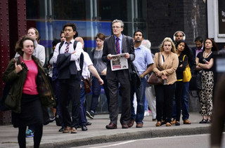 Commuters queue for buses outside Waterloo Station in London, Britain August 6, 2015. Millions of Londoners struggled to work on Thursday as a strike brought the Underground rail network to a standstill for the second time in a month over plans for a new all-night service.  REUTERS/Dylan Martinez