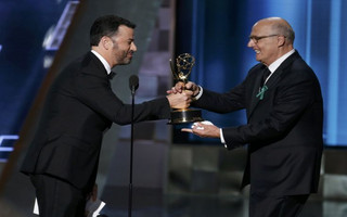 Tambor accepts the award for Outstanding Lead Actor In A Comedy Series for Amazon Studios' "Transparent" from presenter Kimmel at the 67th Primetime Emmy Awards in Los Angeles