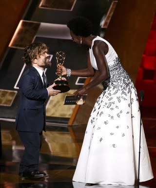 Peter Dinklage accepts the award for Outstanding Supporting Actor In A Drama Series for his role in HBO's "Game of Thrones" from presenter Viola Davis at the 67th Primetime Emmy Awards in Los Angeles, California September 20, 2015.  REUTERS/Lucy Nicholson