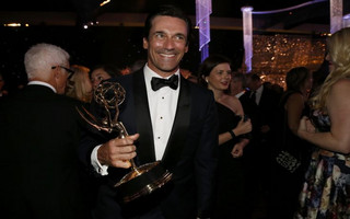 Actor Jon Hamm holds his award for Outstanding Lead Actor in a Drama Series for his role on AMC's "Mad Men" at the 67th Annual Primetime Emmy Awards Governors Ball in Los Angeles