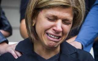 Tima Kurdi cries while speaking to the media outside her home in Coquitlam, B.C.
