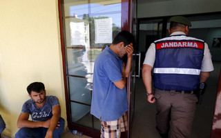 Abdullah Kurdi, father of three-year-old Aylan Kurdi, waits in front of a morgue in Mugla, Turkey