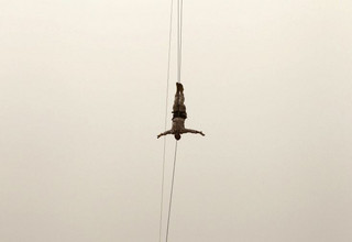 A member of the Lebanese Army's airborne regiment performs a live drill, held as part of a weapons exhibition during the Security Middle East Show in Beirut