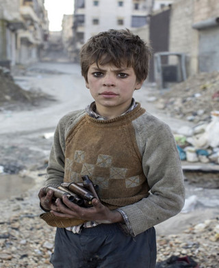 Aleppo, Syria Nine year old Alladin collects used ammunition at the frontline to sell as metal.  Copyright and Photo:Niclas Hammarström 2013-01-14