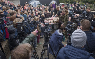 Members of the media film the dissection of a lion at Odense Zoo in Odense, Denmark