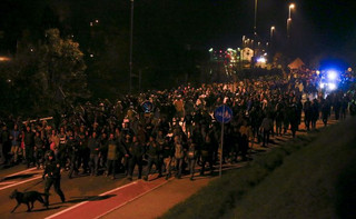 Migrants walk towards the Austrian border after arriving by train in the village of Sentilj, Slovenia, October 20, 2015. Slovenia will ask the European Union to send additional police forces to its border with Croatia to help it deal with thousands of migrants streaming into the tiny country on their way to Austria and beyond. Attempts by Slovenia to stem the flow of migrants since Hungary sealed its border with Croatia on Friday have triggered a knock-on effect through the Balkans, with thousands held up at border crossings. REUTERS/Leonhard Foeger