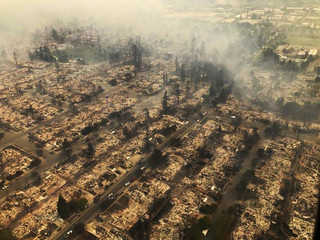 This aerial photo provided by the California Highway Patrol Golden Gate Division shows some of hundreds of homes destroyed in a wind-driven wildfire that swept through Santa Rosa, Calif., early Monday, Oct. 9, 2017. (California Highway Patrol Golden Gate Division via AP)