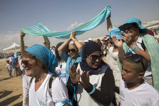 Israeli and Palestinian women participate in a march organized by the "Women Wage Peace" organization, near the Dead Sea, Sunday, Oct. 8, 2017. Thousands of women are wrapping up the march around the region, demanding that their leaders act to achieve a peace agreement. “The group says the two-week march sends a message to their leaders to work toward a negotiated solution to the Israeli-Palestinian conflict and to make sure women have equal representation in any talks. (AP Photo/Sebastian Scheiner)