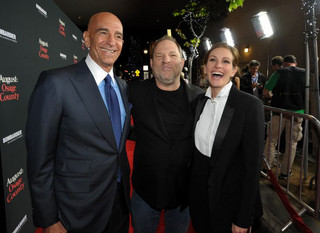 From left, Tom Barrack, Chairman of Miramax, Harvey Weinstein, Co-Chairman, The Weinstein Company, and Julia Roberts arrive at The Weinstein Company's Los Angeles premiere of "August: Osage County" in partnership with Bombardier at Regal Cinemas L.A. Live on Monday, Dec. 16, 2013. (Photo by John Shearer/Invision for The Weinstein Company/AP Images)