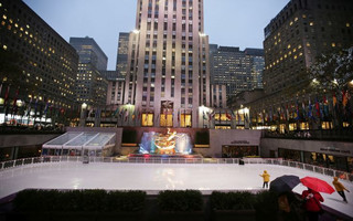 People watch attendants skate past the statue of Prometheus at the ice rink at Rockefeller Center in New York Wednesday, Oct. 11, 2017, in New York. (AP Photo/Frank Franklin II)