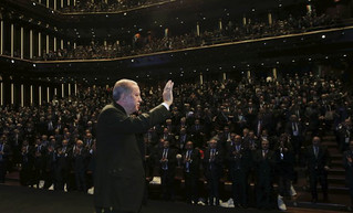 Turkey's President Recep Tayyip Erdogan acknowledges the audience as he arrives to deliver a speech at a tourism council in Ankara, Turkey, Wednesday, Nov. 1, 2017. (Pool Photo via AP)