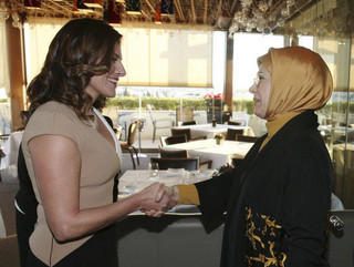 Betty Baziana, left, partner of Greece's Prime Minister Alexis Tsipras, shakes hands with Emine Erdogan, wife of Turkey's President Recep Tayyip Erdogan, in Athens, Thursday, Dec. 7, 2017. Erdogan is in Greece on a two-day official visit. (Pool via AP)