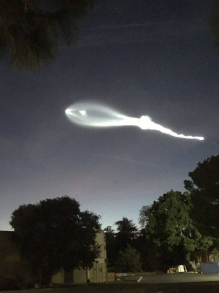 The contrail from a SpaceX Falcon 9 rocket is seen from Burbank, Calif., more than 100 miles southeast from its launch site in Vandenberg Air Force Base, Calif., on Friday, Dec. 22, 2017. A reused SpaceX rocket carried 10 satellites into orbit from California on Friday, leaving behind a trail of mystery and wonder as it soared into space. The launch in the setting sun created a shining, billowing streak that was widely seen throughout Southern California and as far away as Phoenix. (AP Photo/Jimmy Golen) The contrail from a SpaceX Falcon 9 rocket is seen from Burbank, Calif., more than 100 miles southeast from its launch site in Vandenberg Air Force Base, Calif., on Friday, Dec. 22, 2017. A reused SpaceX rocket carried 10 satellites into orbit from California on Friday, leaving behind a trail of mystery and wonder as it soared into space. The launch in the setting sun created a shining, billowing streak that was widely seen throughout Southern California and as far away as Phoenix. (AP Photo/Jimmy Golen)