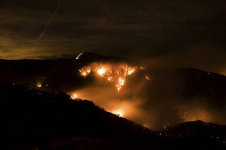 A hillside glows with embers as a wildfire burns through Los Padres National Forest near Ojai, Calif., on Friday, Dec. 8, 2017. (AP Photo/Noah Berger)