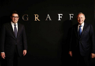 FILE - In this Monday, May 21, 2012 file photo, Graff Diamonds Founder and Chairman Laurence Graff, right, and CEO Francois Graff stands before attending an IPO roadshow in Hong Kong. The London jeweler said Thursday, May 31, 2012 in a brief statement that it's postponing plans to go public in the southern Chinese financial center because of the recent downturn in global financial markets. Graff Diamonds would have been the latest in a line of foreign luxury brands to sell shares in Hong Kong. (AP Photo/Vincent Yu, File) FILE - In this Monday, May 21, 2012 file photo, Graff Diamonds Founder and Chairman Laurence Graff, right, and CEO Francois Graff stands before attending an IPO roadshow in Hong Kong. The London jeweler said Thursday, May 31, 2012 in a brief statement that it's postponing plans to go public in the southern Chinese financial center because of the recent downturn in global financial markets. Graff Diamonds would have been the latest in a line of foreign luxury brands to sell shares in Hong Kong. (AP Photo/Vincent Yu, File)