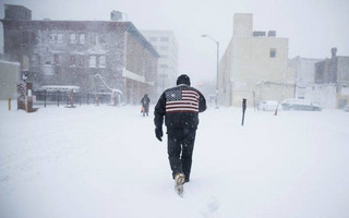 A man pushes his way through a winter snowstorm in Atlantic City, N.J., Thursday, Jan. 4, 2018. A massive winter storm swept from the Carolinas to Maine on Thursday, dumping snow along the coast and bringing strong winds that will usher in possible record-breaking cold. (AP Photo/Matt Rourke)