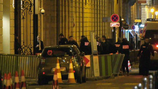 In this image made from video, French police attend the scene outside the Ritz Hotel in Paris, France, after a robbery Wednesday evening Jan. 10, 2018.  Police said Wednesday that five people, at least some armed, entered the luxury Ritz Hotel and made off with goods, likely to be jewels, worth “an important” sum, and reported that three robbers were arrested and two escaped capture.(Clement Lanot via AP)