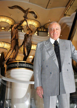 Harrods chairman Mohamed Al Fayed unveils a new memorial statue, seen in background, on the 8th anniversary of the deaths of his son Dodi and Diana, Princess of Wales at Harrods department store in London's Knightsbridge, Thursday, Sept. 1, 2005. Diana died in a car crash in Paris, along with boyfriend Dodi Fayed and chauffeur Henri Paul. The only survivor was Diana's bodyguard, Trevor Rees-Jones, who was badly hurt.(AP Photo/ Jane Mingay)
