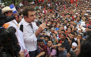 Opposition leader Salvador Nasralla speaks to supporters at a rally where he reaffirmed his claim on the presidency of Honduras, in the central park of San Pedro Sula, Honduras, Saturday, Jan. 6, 2018. Following a disputed election marred by irregularities, incumbent Juan Orlando Hernandez was declared the victor and will be inaugurated on Jan. 27. At a march and rally that drew thousands, Nasralla said he would not stop calling for protests and civil disobedience until Hernandez agrees to step down. (AP Photo/Fernando Antonio)