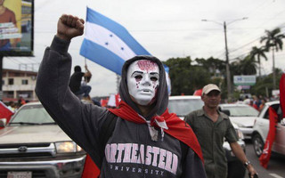 Opposition supporters protest in a march led by Salvador Nasralla, who reaffirmed his claim on the presidency, in the central park of San Pedro Sula, Honduras, Saturday, Jan. 6, 2018. Following a disputed election marred by irregularities, incumbent Juan Orlando Hernandez was declared the victor and will be inaugurated on Jan. 27. At a march and rally that drew thousands, Nasralla said he would not stop calling for protests and civil disobedience until Hernandez agrees to step down. (AP Photo/Fernando Antonio)