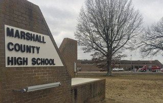 Authorities investigate the scene of fatal school shooting Tuesday, Jan 23, 2018, in Benton, Ky. Kentucky State Police said the suspect was apprehended by a Marshall County deputy. (AP Photo/Stephen Lance Dennee)