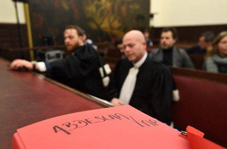 Belgian lawyer Sven Mary, center, attends the trial of Salah Abdeslam at the Brussels Justice Palace in Brussels on Monday, Feb. 5, 2018. Salah Abdeslam and Soufiane Ayari face trial for taking part in a shooting incident in Vorst, Belgium on March 15, 2016. The incident took place when six members of a Franco-Belgian research team investigating the attacks in Paris were conducting a search in an allegedly empty safe house of the terrorists and were attacked. (Emmanuel Dunand, Pool Photo via AP)