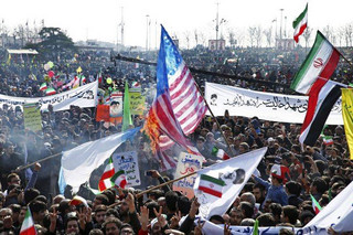 Iranians burn a representation of U.S. flag during a rally marking the 39th anniversary of the 1979 Islamic Revolution, in Tehran, Iran, Sunday, Feb. 11, 2018. Hundreds of thousands of Iranians rallied on the streets Sunday to mark the anniversary, just weeks after anti-government protests rocked cities across the country. (AP Photo/Ebrahim Noroozi)